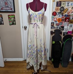 Spaghetti strap cream floral dress with handkerchief hem